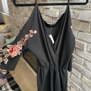 Never worn black romper with floral 3-D printing